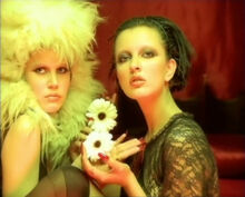 Pola Weiss as she appears in the "Long Hard Road Out of Hell" music video (at the left)